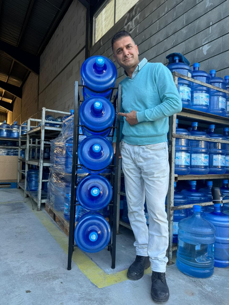 MERSINI water delivery person